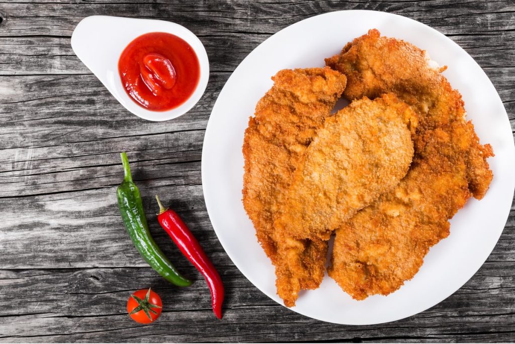 Panierte Hähnchenschnitzel mit Ingwer im Ofen